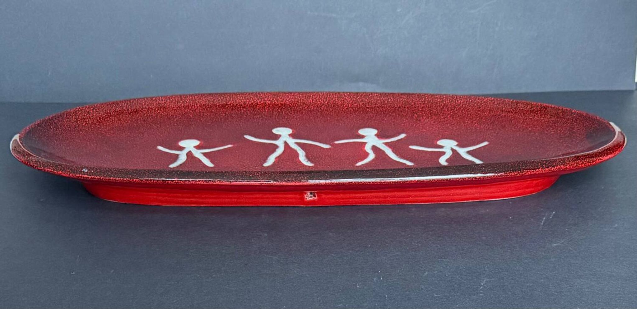 Large red ceramic dish