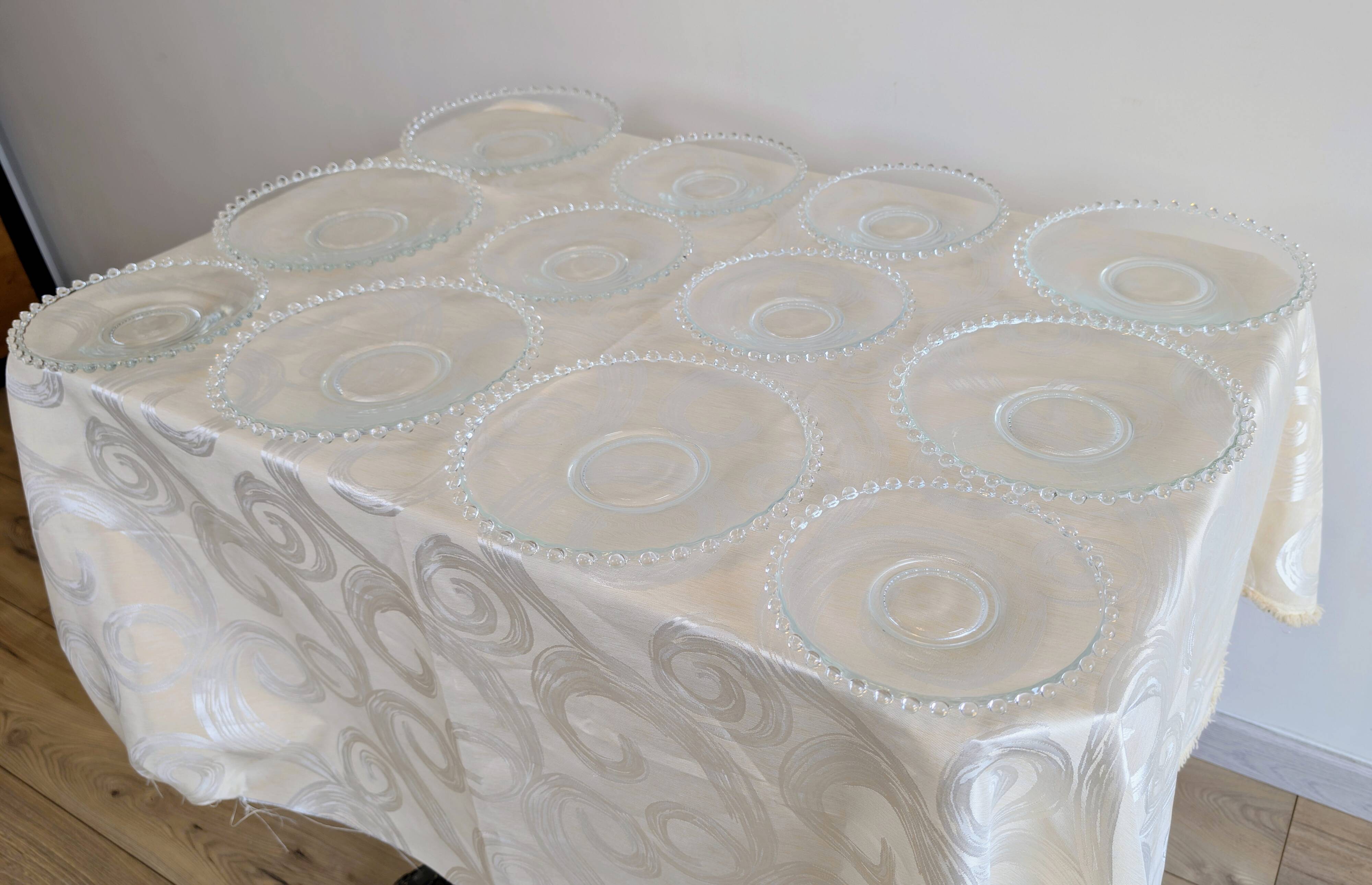 Vintage service of 12 pressed glass plates with bead decoration.