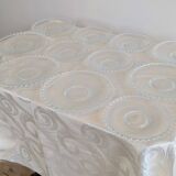 Vintage service of 12 pressed glass plates with bead decoration.