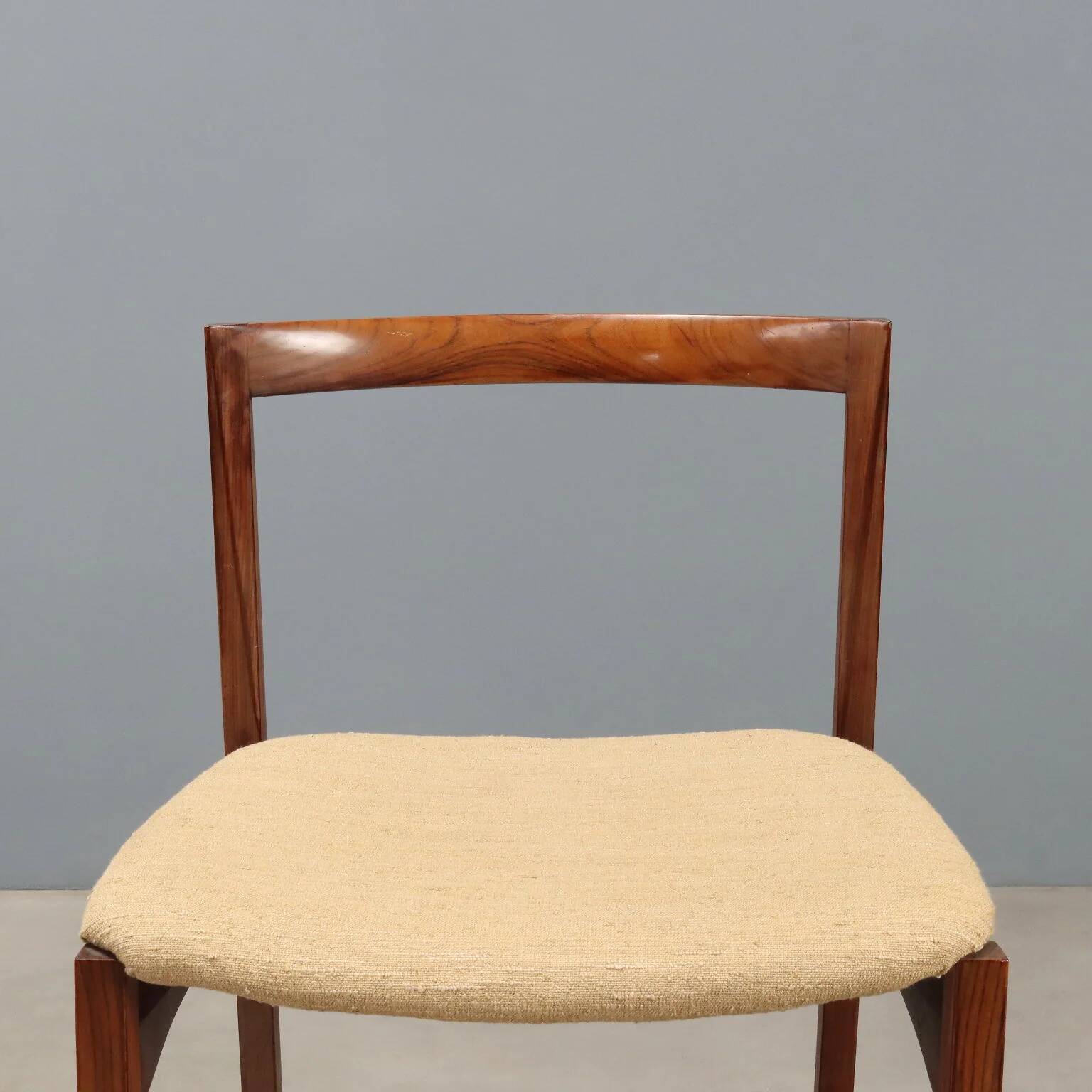 Vintage lounge chairs in exotic wood and fabric, 1960s design.