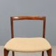 Vintage lounge chairs in exotic wood and fabric, 1960s design.