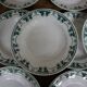 11 white and green earthenware soup plates from Saint Amand Terre de Fer