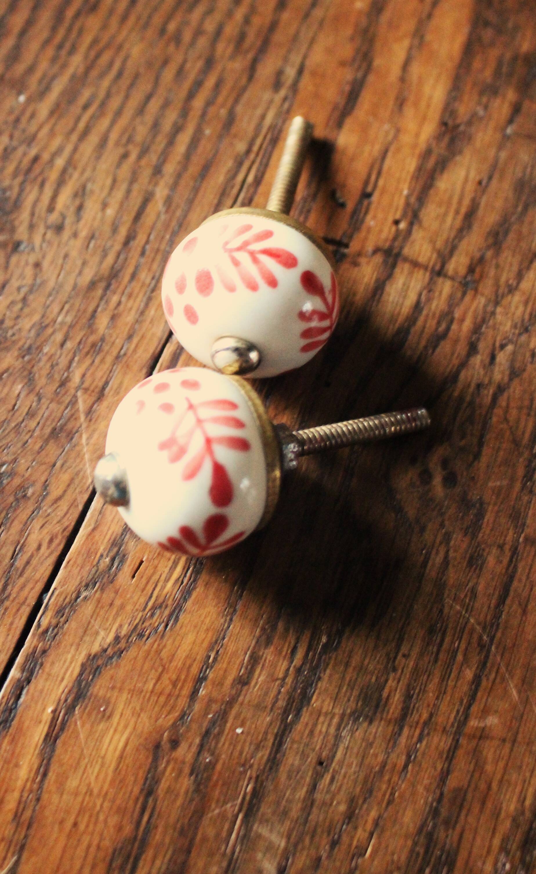 Pair of white and red porcelain drawer cupboard door knobs