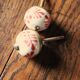 Pair of white and red porcelain drawer cupboard door knobs