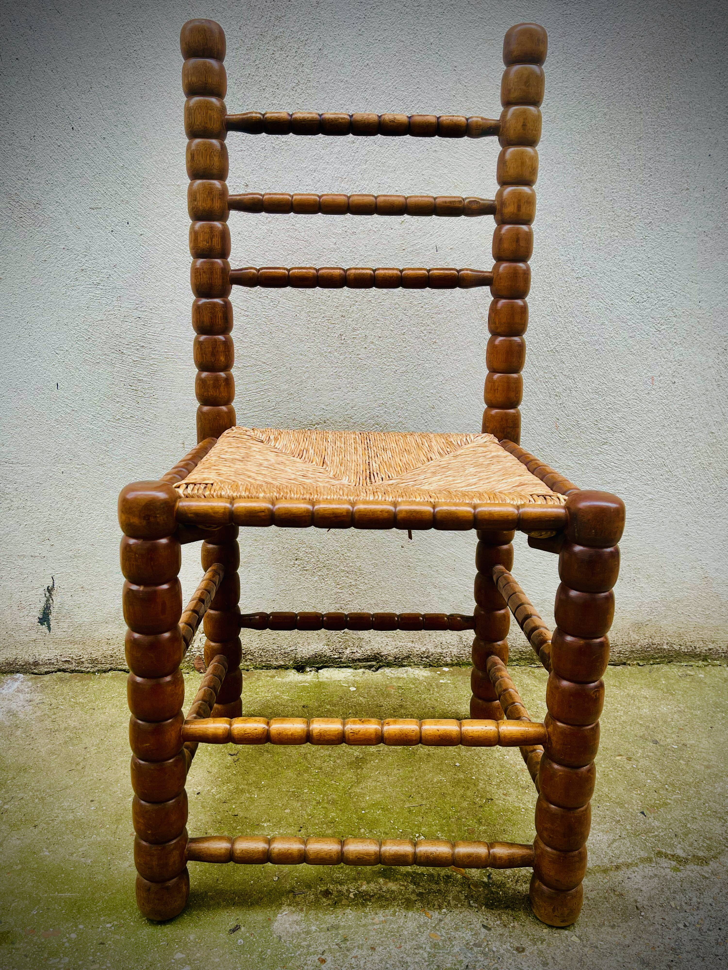 Brutalist chairs mulched in turned wood from the 60s