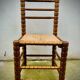 Brutalist chairs mulched in turned wood from the 60s