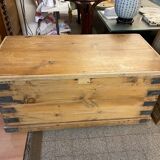 Old trunk in natural pine wood with padded interior