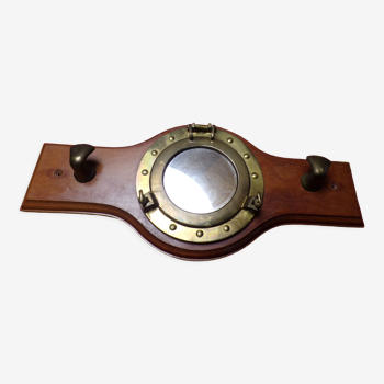 Marine style coat rack with porthole mirror