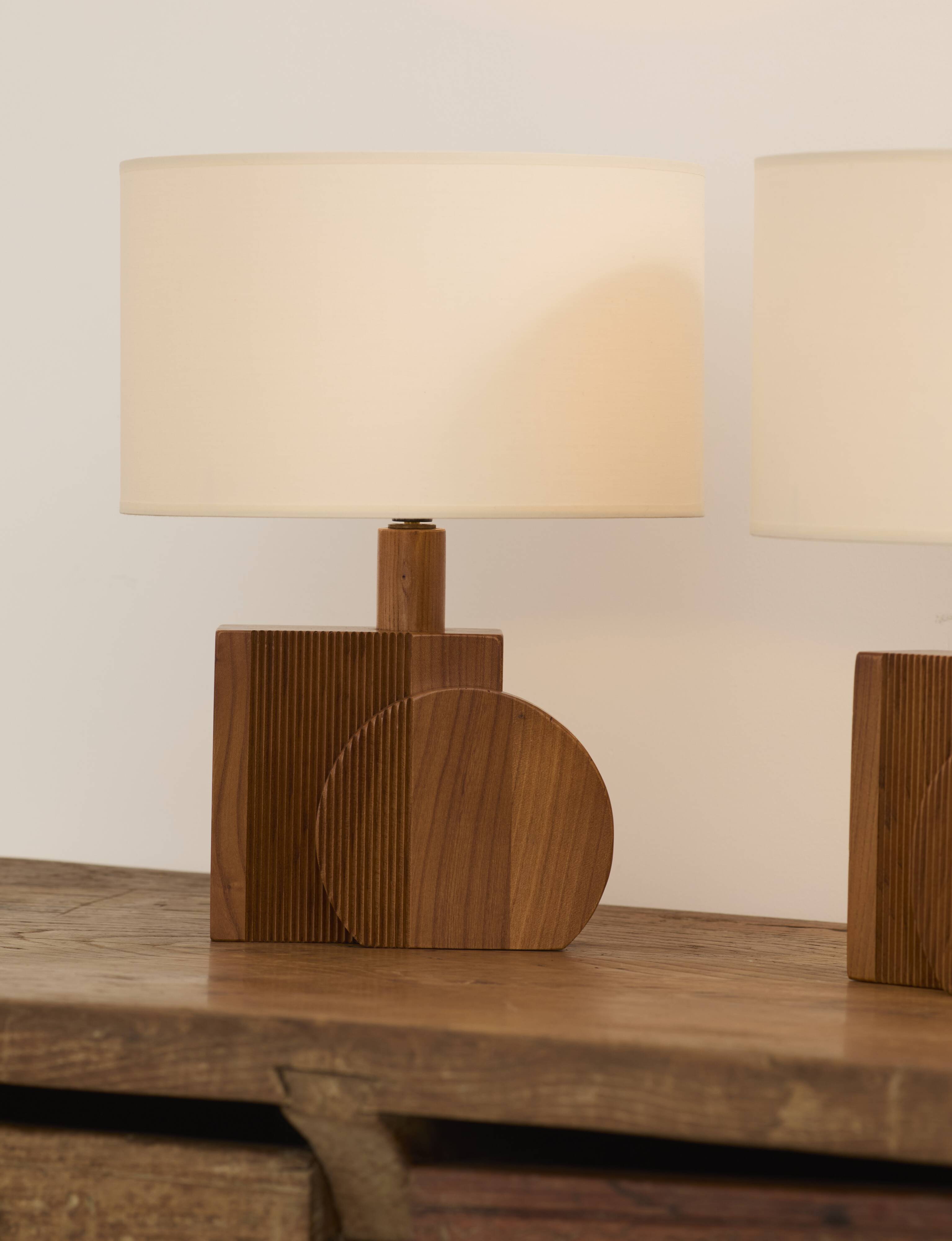 Pair of geometric handcrafted lamps in solid oak circa 1970.