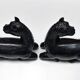 Black marble bookends with lying horses