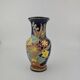 Large multicoloured ceramic vase with floral decoration signed NT.