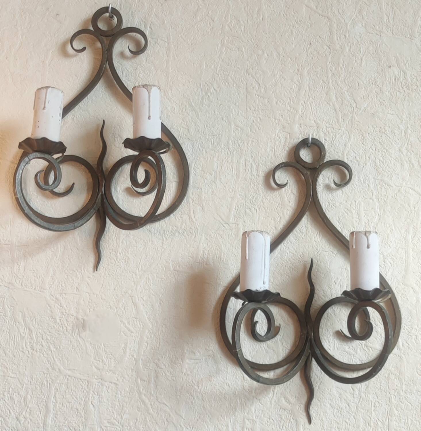 Old pair of wrought iron wall lights