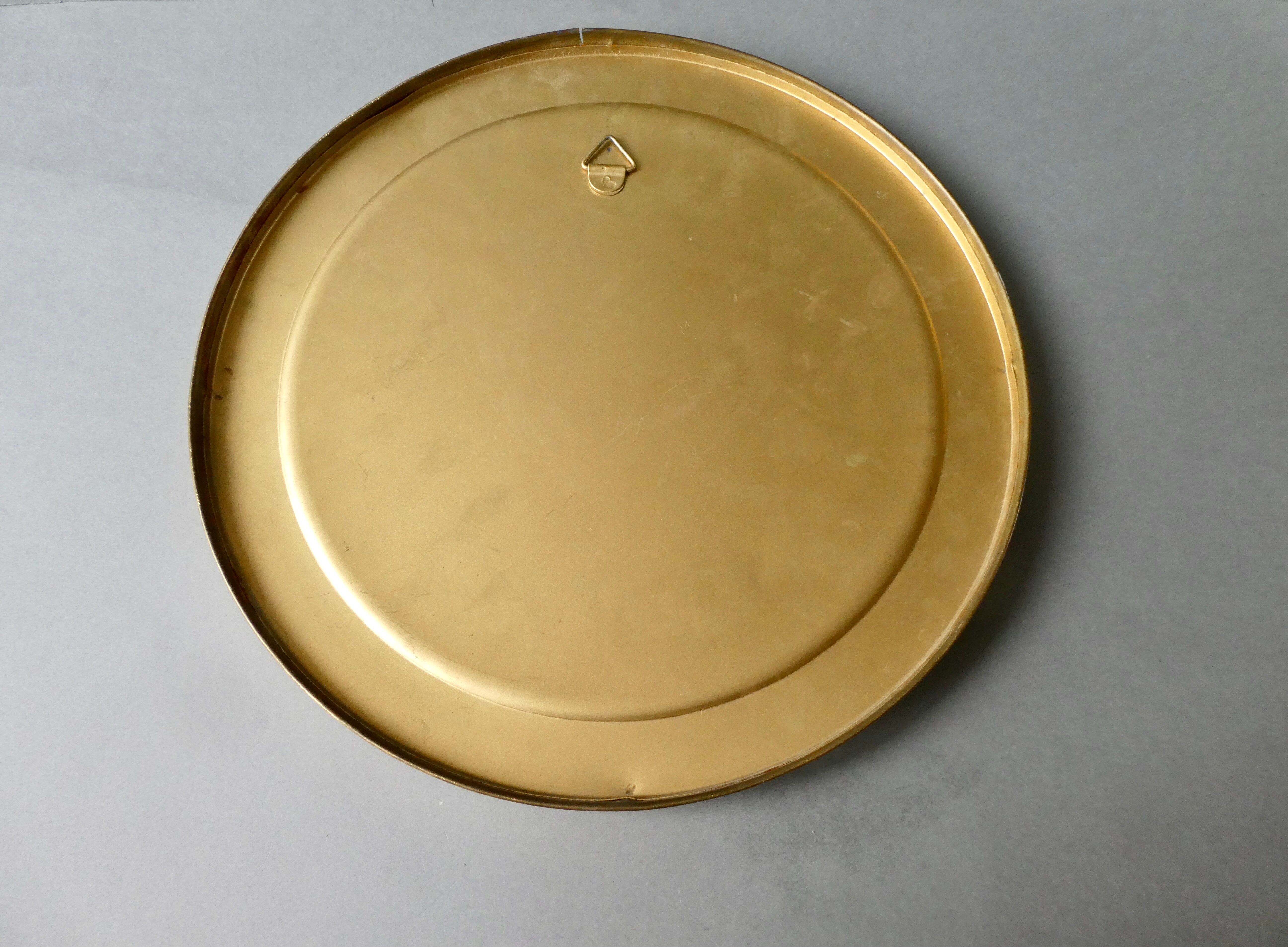 Curved mirror, in a brass porthole, 70s