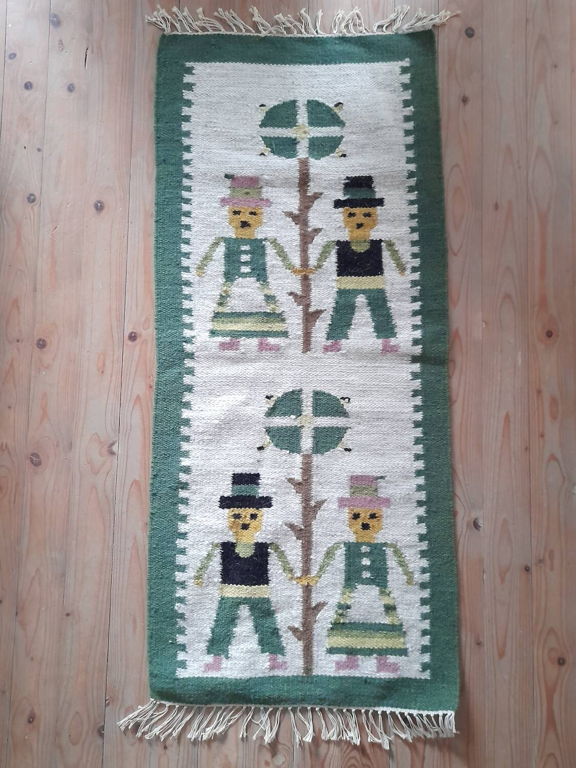 Small wool rug with a 70s Danish folk pattern.