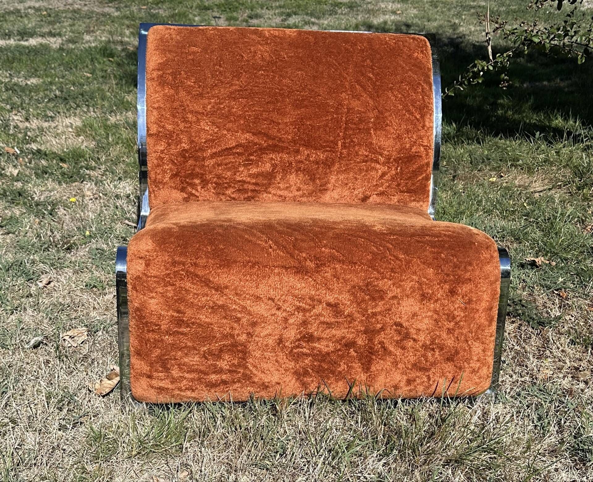 Chrome steel armchair and orange fabric by Vittorio Introini