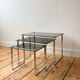 Nest of coffee tables in chrome with smoked glass top.