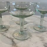 Set of four blown glass stemmed glasses.