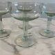 Set of four blown glass stemmed glasses.