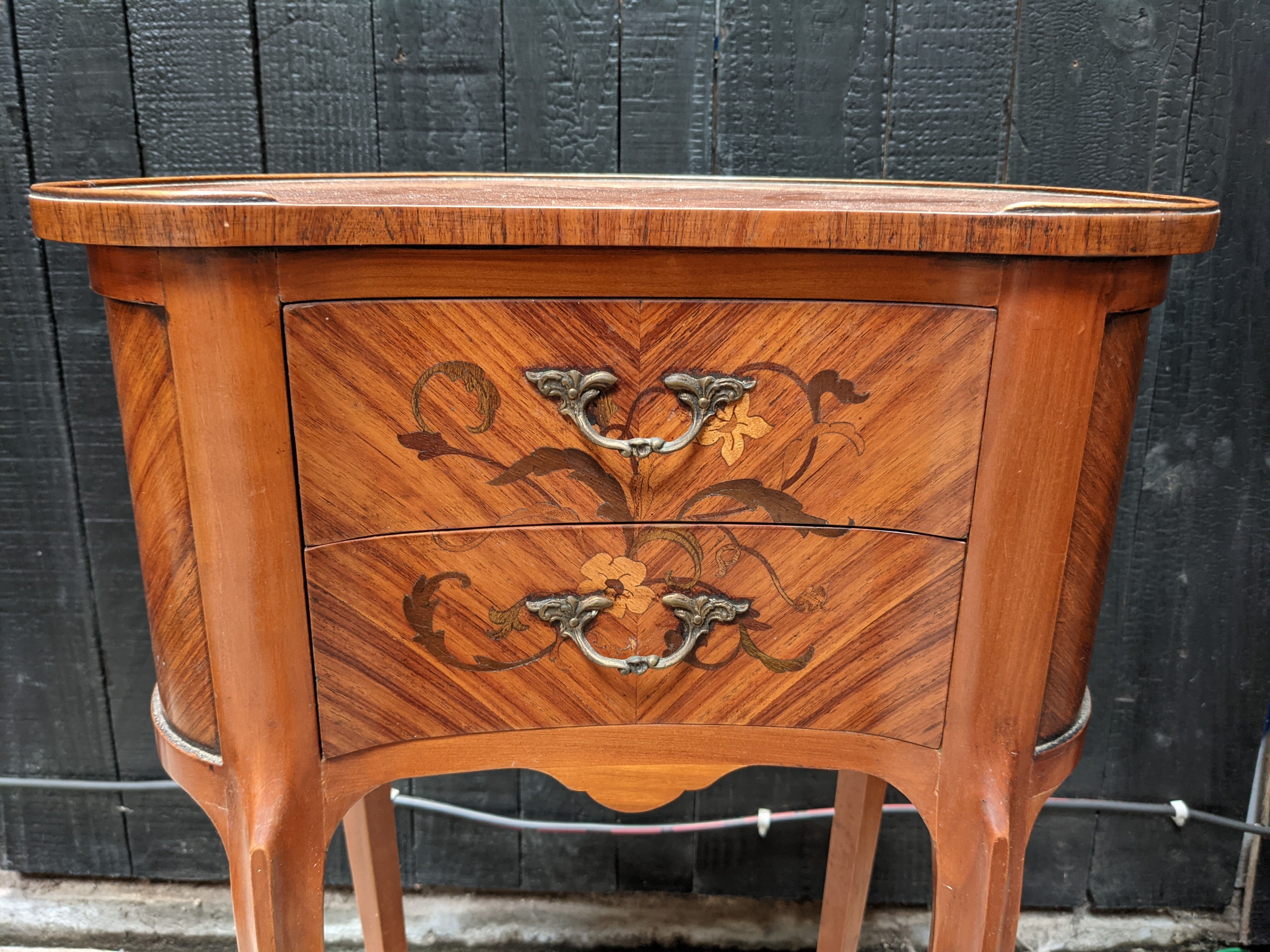 Pair of kidney bedside tables