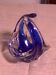 Ashtray in transparent and blue blown glass with a design shape