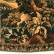 Tapestry decorated with a pink flamingo in a green landscape, woven by hand