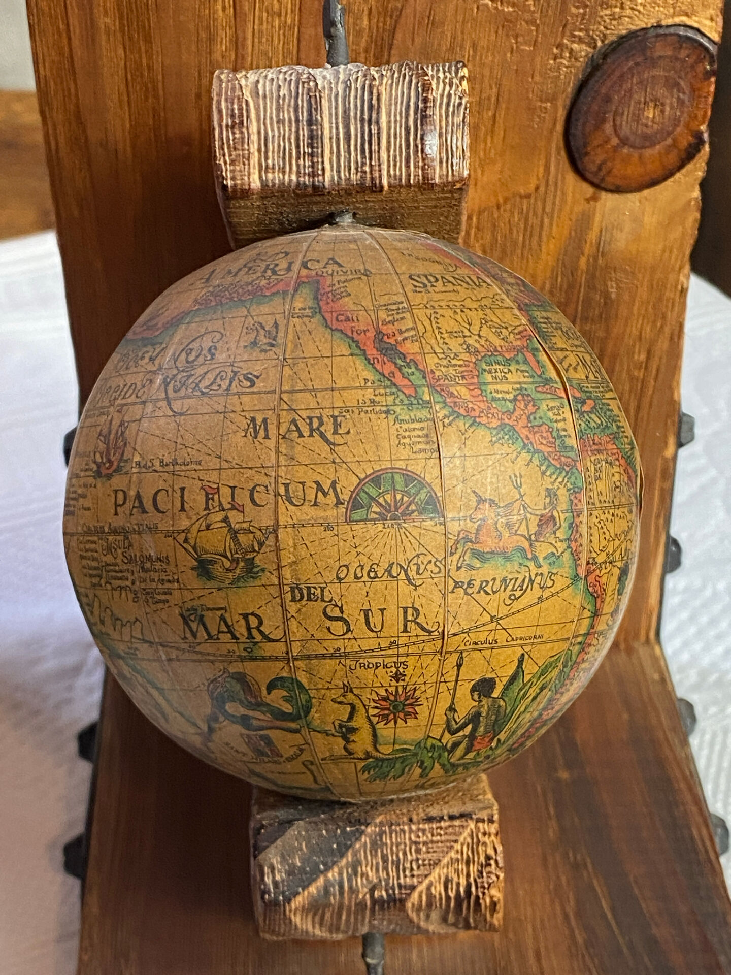 Pair of wooden bookends, rotating globes