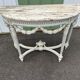 Louis XVI style half-moon console table with carved and painted wood and marble top