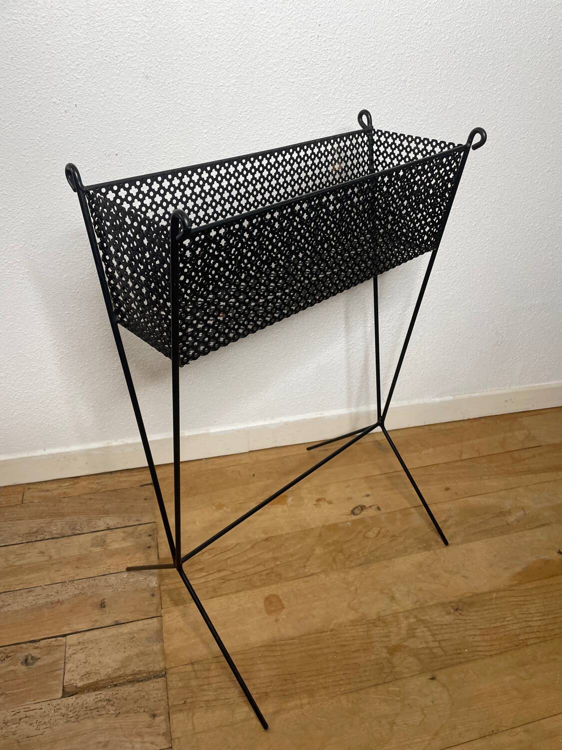 1950s black perforated metal planter in the style of Mathieu MATEGOT