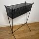 1950s black perforated metal planter in the style of Mathieu MATEGOT