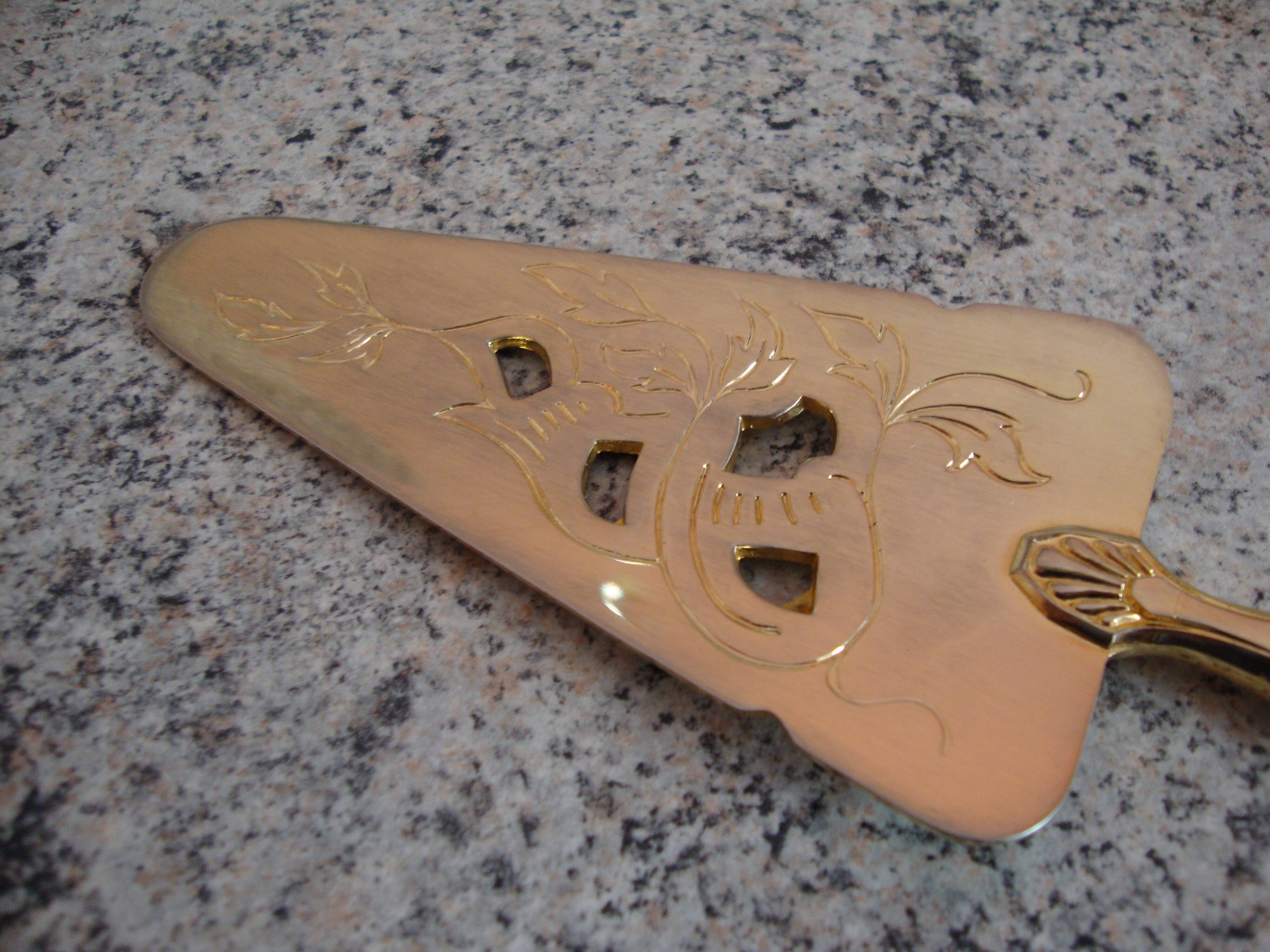 Old gold metal pie shovel