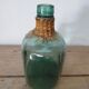 Demijohn with her rattan necklace