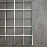 Minimalist white wire coat rack from mid-century Germany, 1960s.