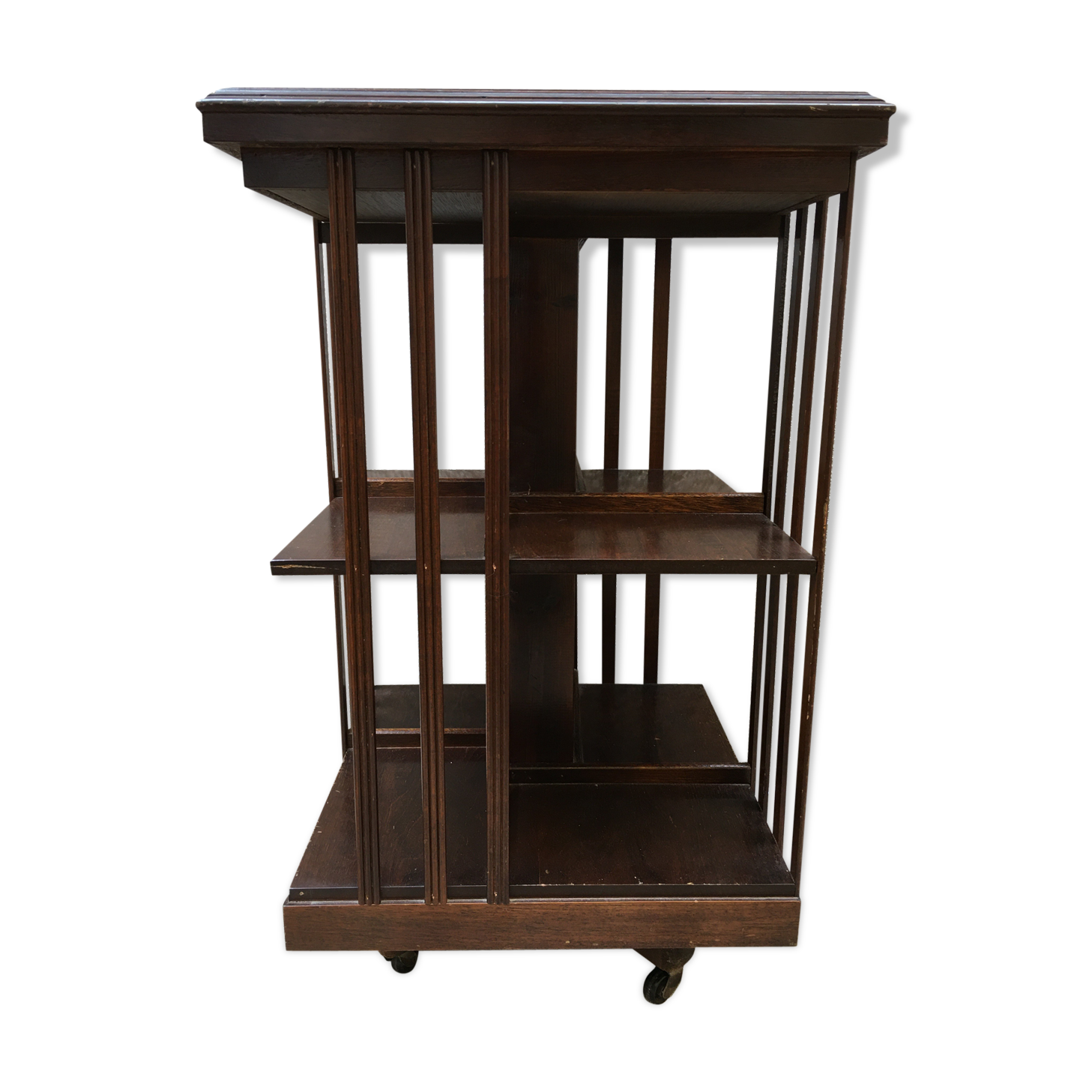 Revolving english library in mahogany, wheeled footing