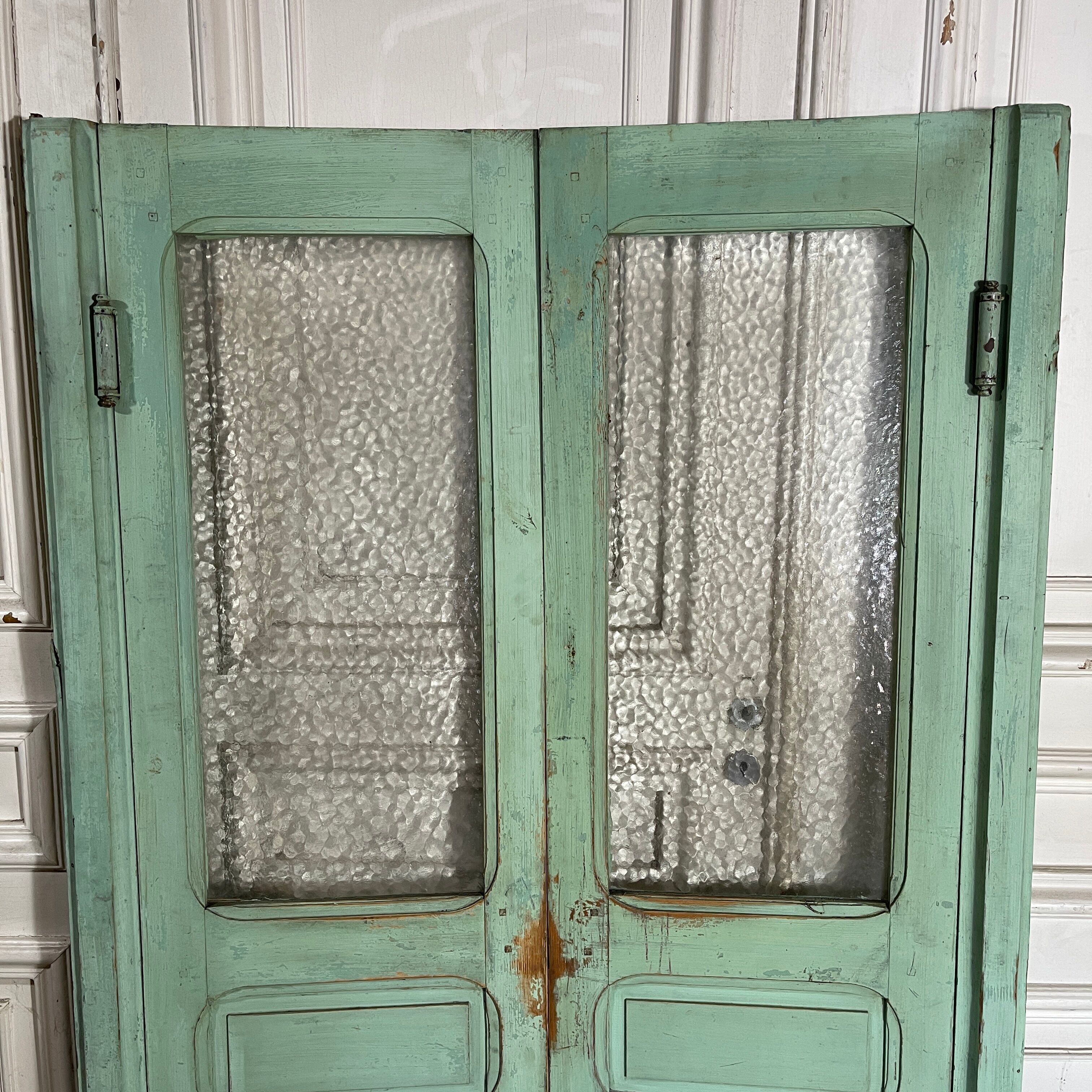 Old pair of saloon type glass doors