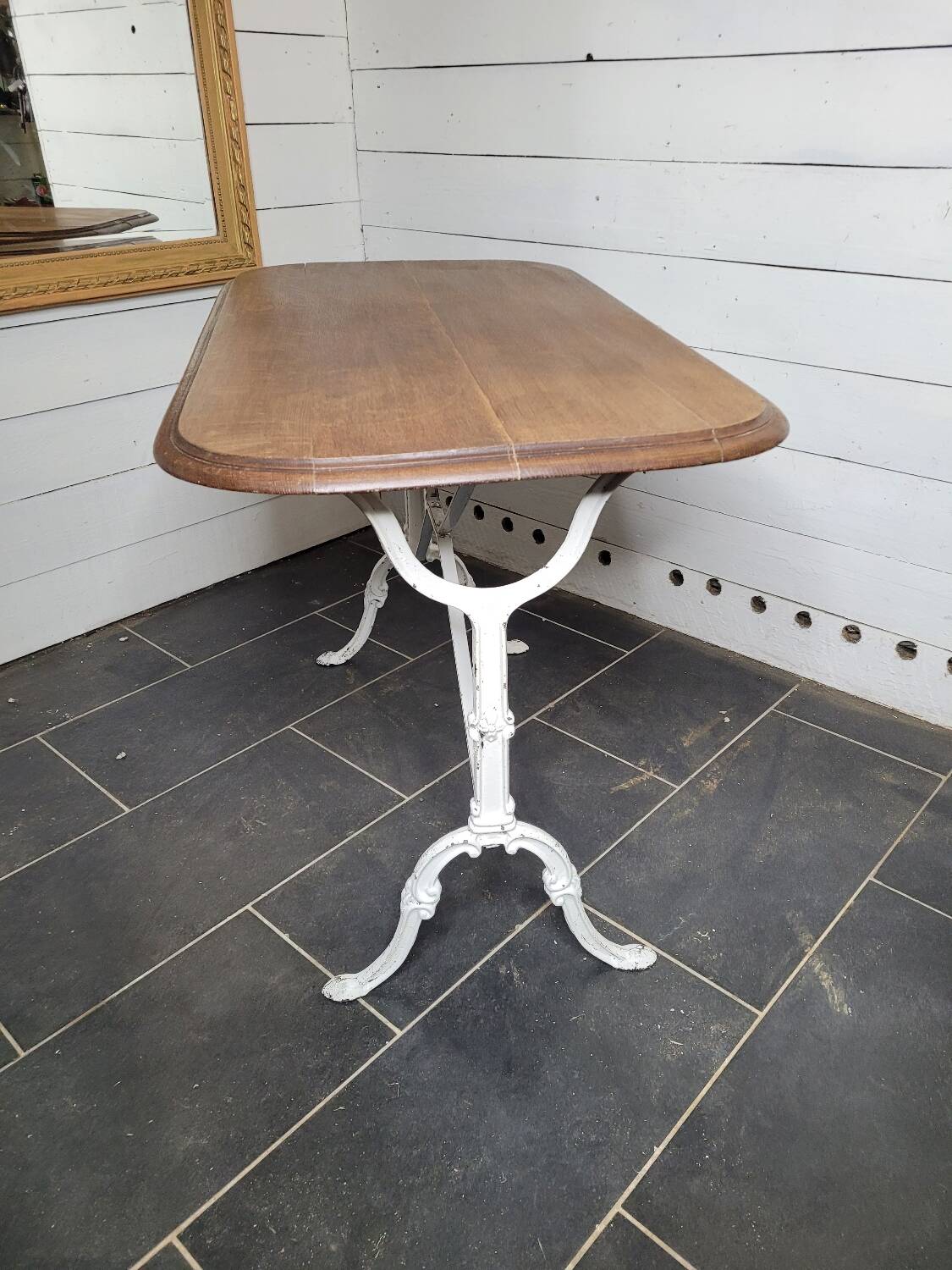 Bistro table with cast iron base and oak top