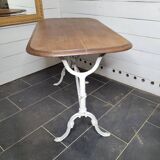 Bistro table with cast iron base and oak top