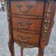 Oval bedside table in Louis XV style with marquetry.