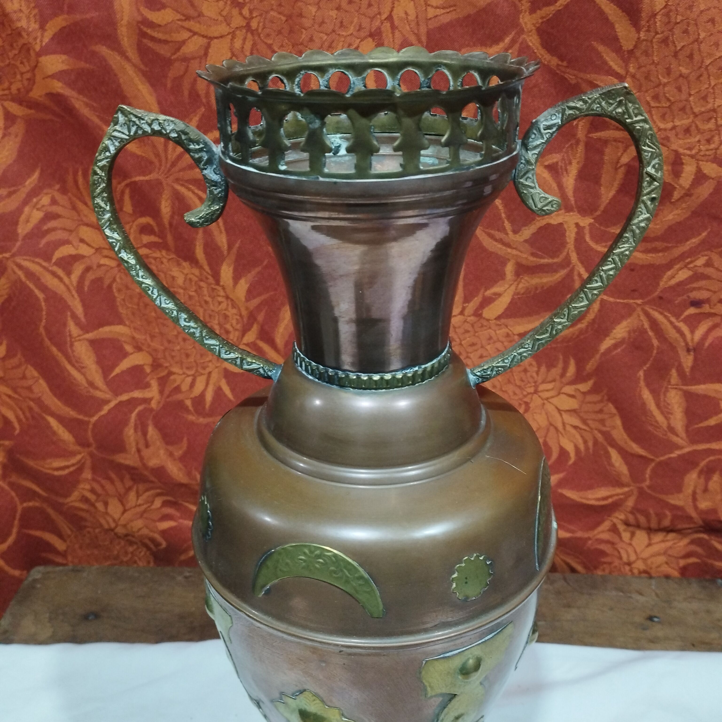 Oriental style vase or copper amphora and brass decoration