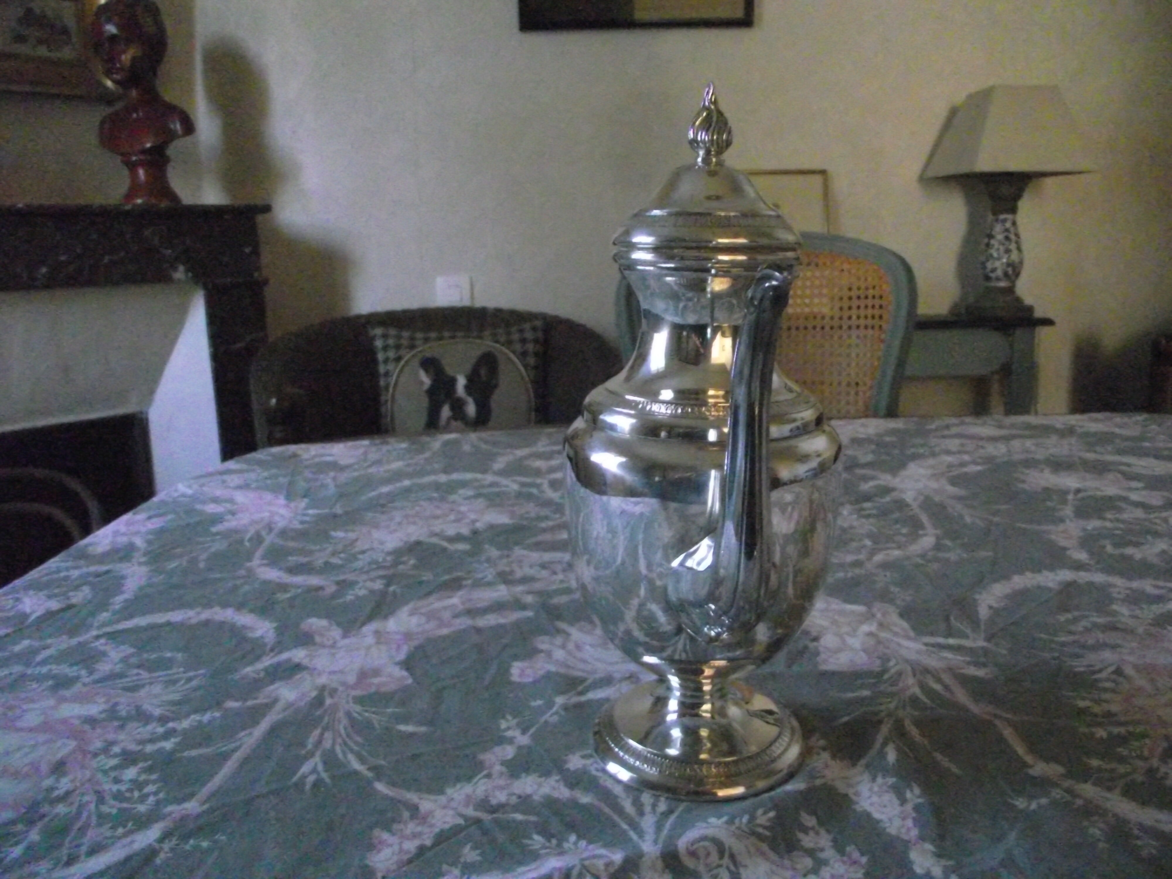 Empire-style silver metal teapot.