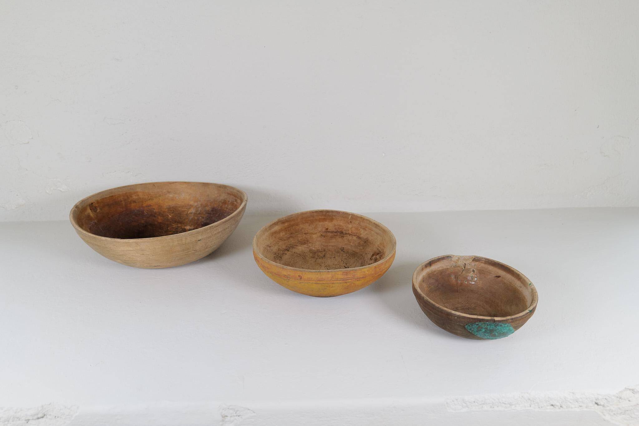 Set of three unique farmhouse bowls from 19th-century Swedish folk art.