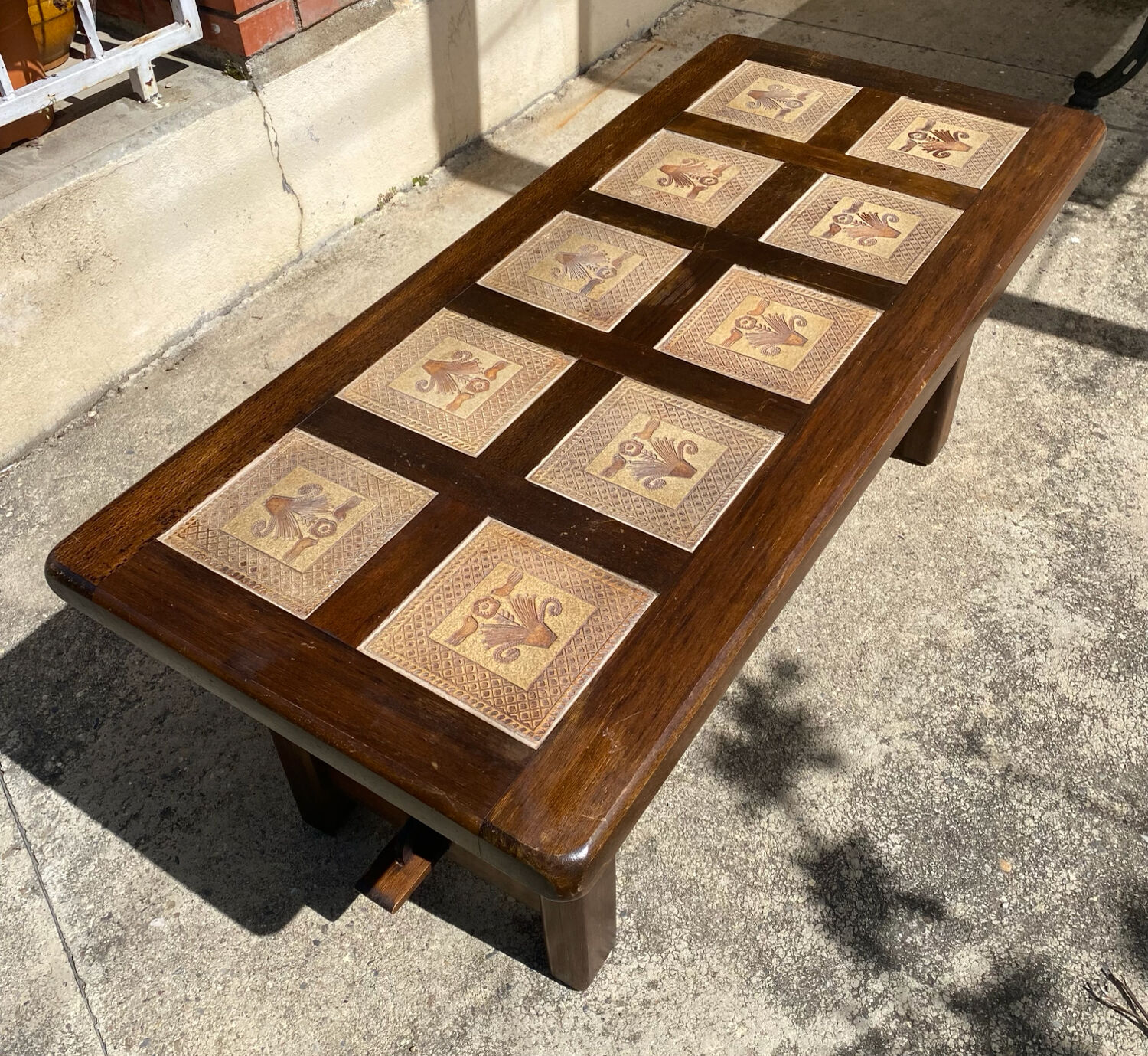 Vintage 60s coffee table with tile decoration of birds and flowers.