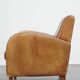 Fauteuil design en cuir de vachette couleur cognac clair