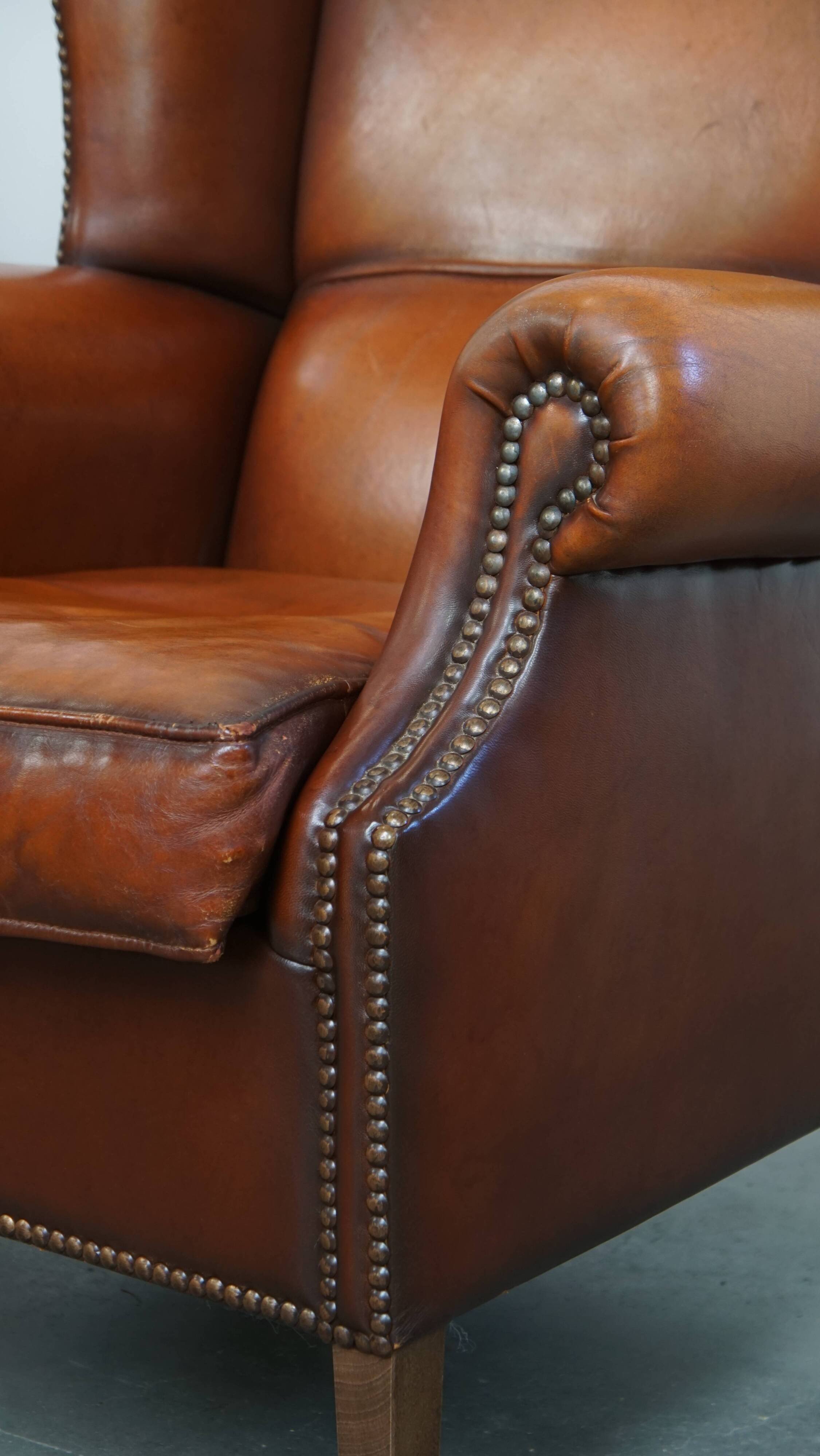 Fauteuil à oreilles en cuir de mouton
