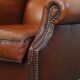 Fauteuil à oreilles en cuir de mouton