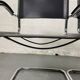 Pair of design armchairs in imitation leather chrome