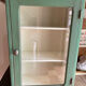 Small wooden cabinet patinated arsenic green