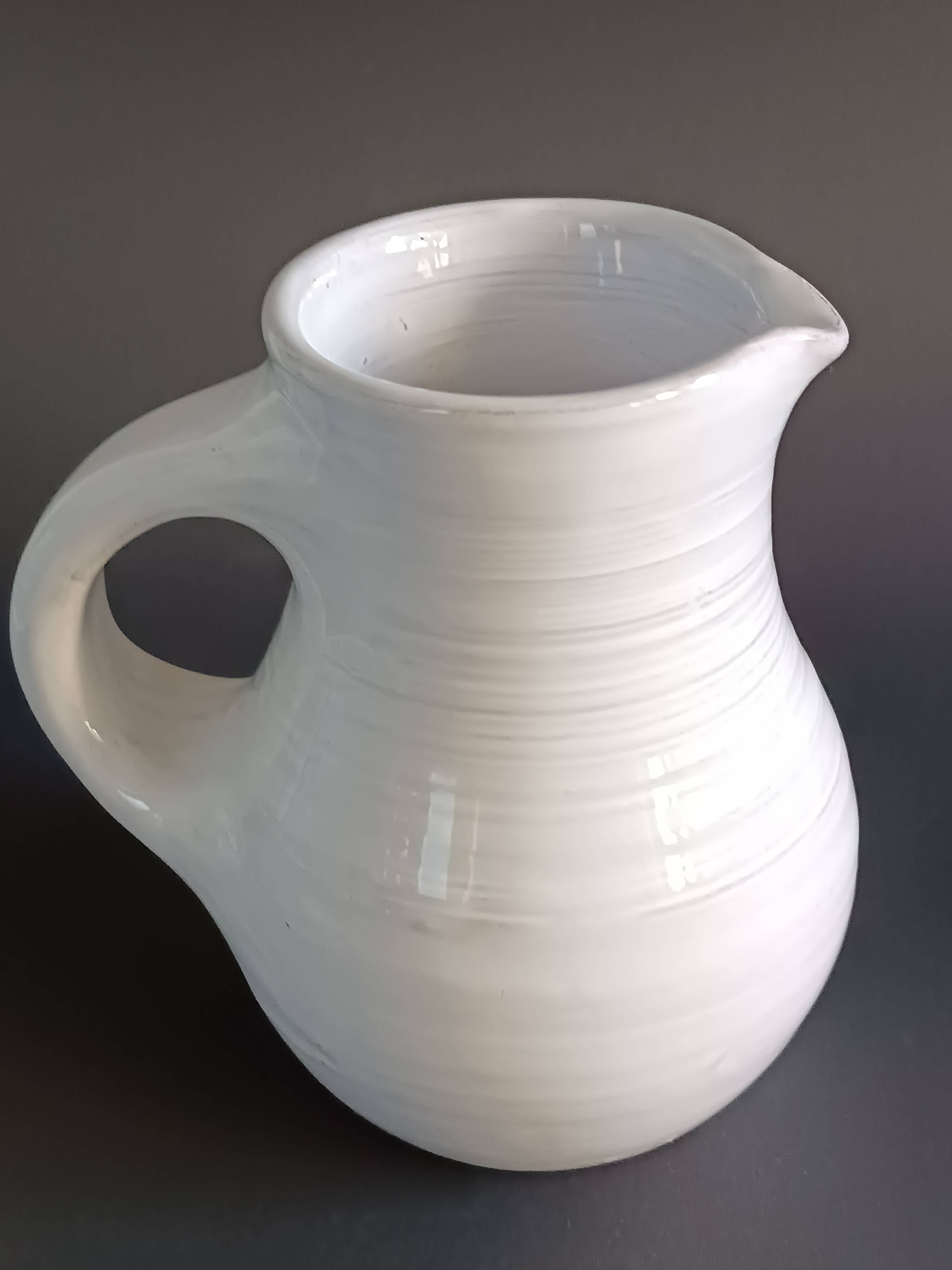Vintage white glazed ceramic pitcher signed