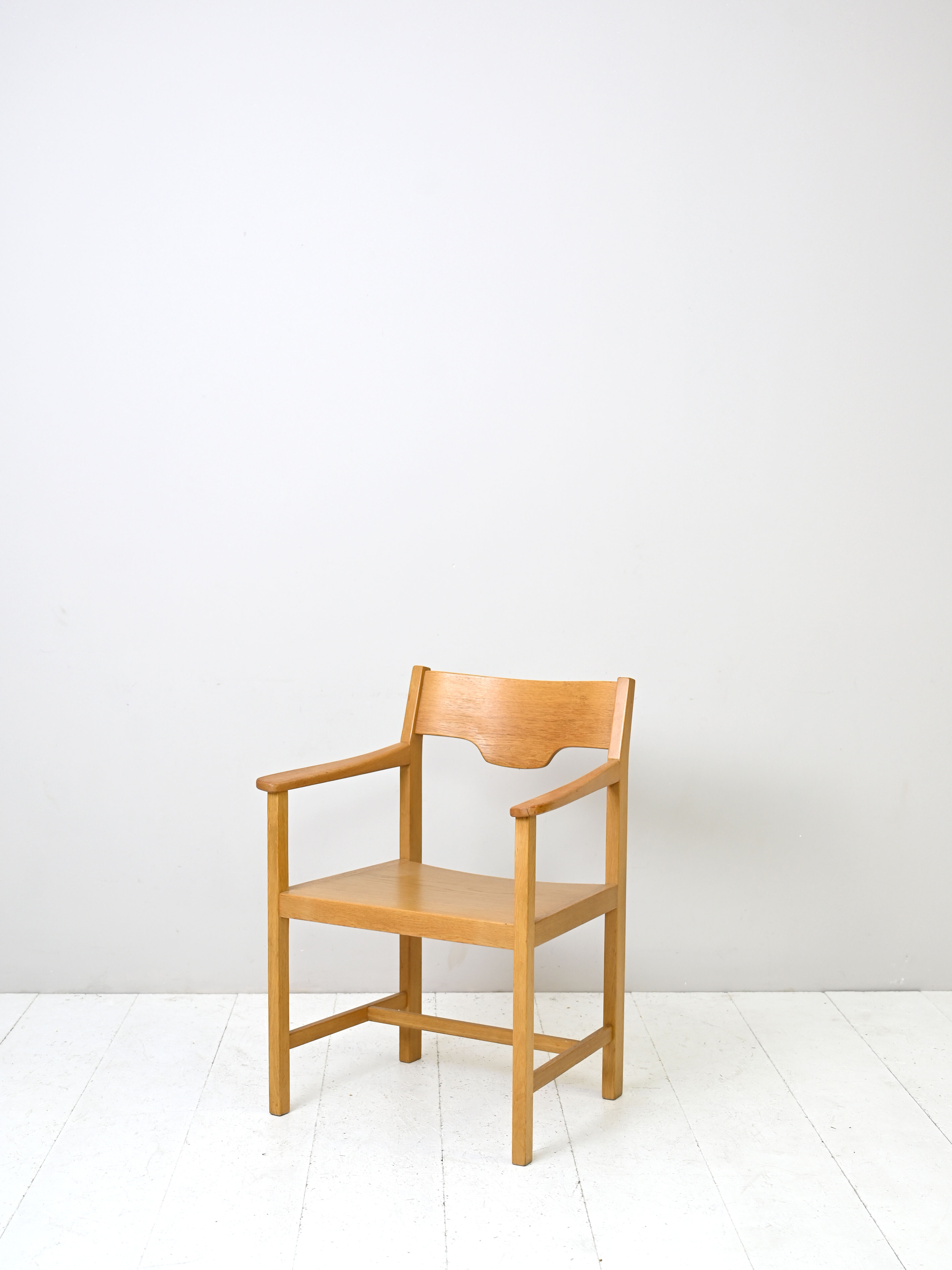 Wooden chair with armrests