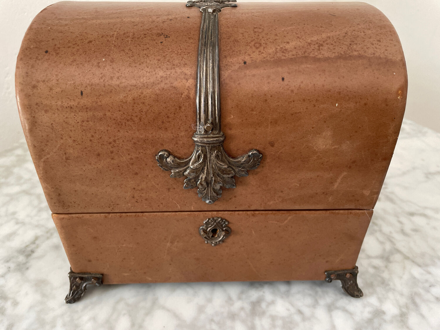 Vintage leather and silver metal jewelry box.