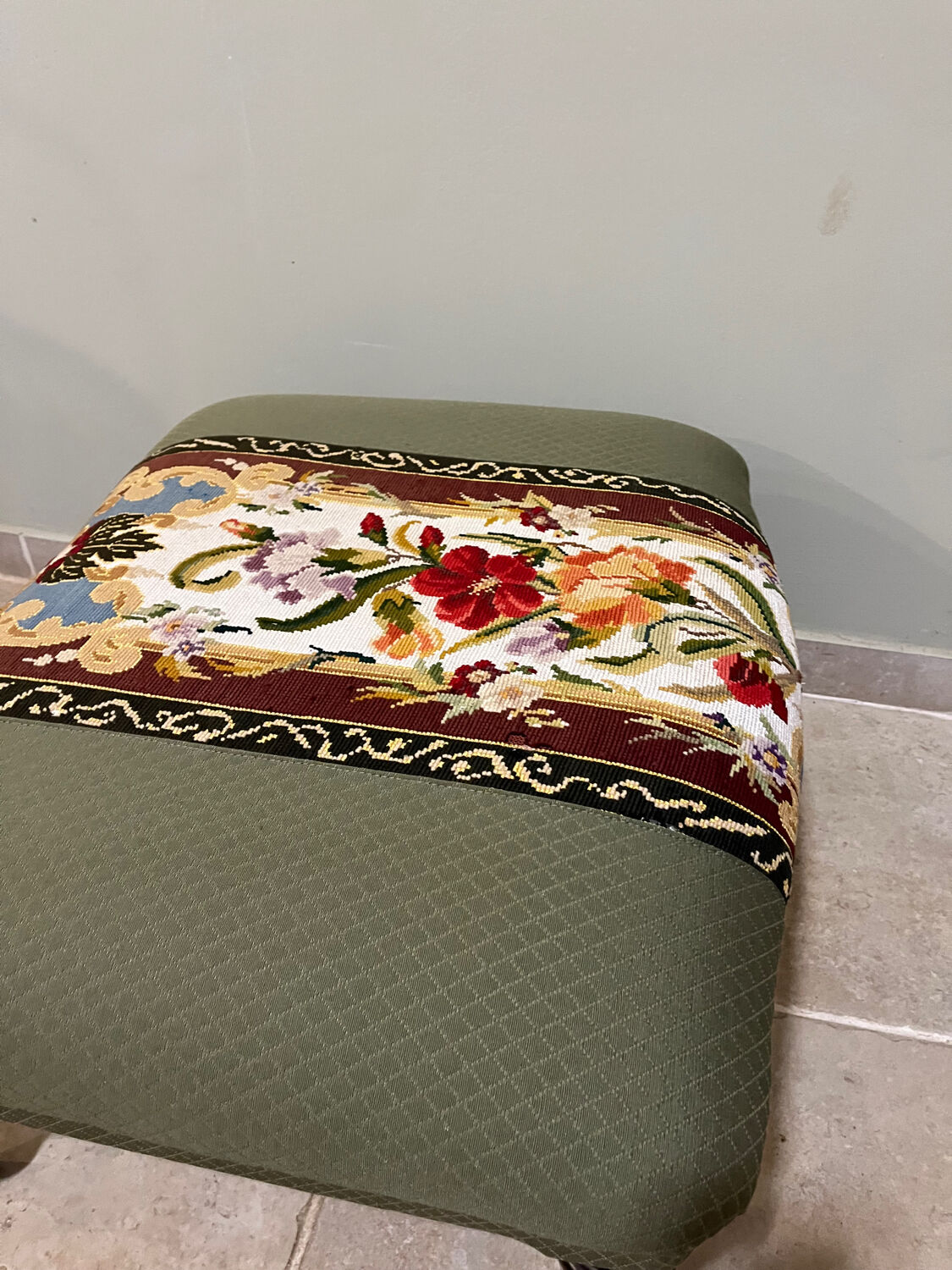 Vintage upholstered footstool, floral decor in Aubusson style.